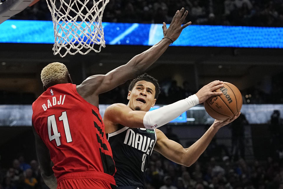 Dallas Mavericks guard Josh Green (8) drives to the basket against Portland Trail Blazers center Ibou Badji (41) during the first half of an NBA basketball game in Dallas, Wednesday, Jan. 3, 2024. (AP Photo/LM Otero)