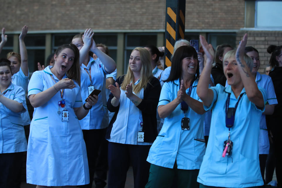 Staff join in the applause at the Freeman Hospital in Newcastle upon Tyne to salute local heroes during Thursday's nationwide Clap for Carers initiative to recognise and support NHS workers and carers fighting the coronavirus pandemic.