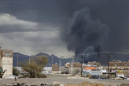 Smoke billows after an air strike hit the international airport of Yemen's capital Sanaa May 4, 2015. REUTERS/Khaled Abdullah