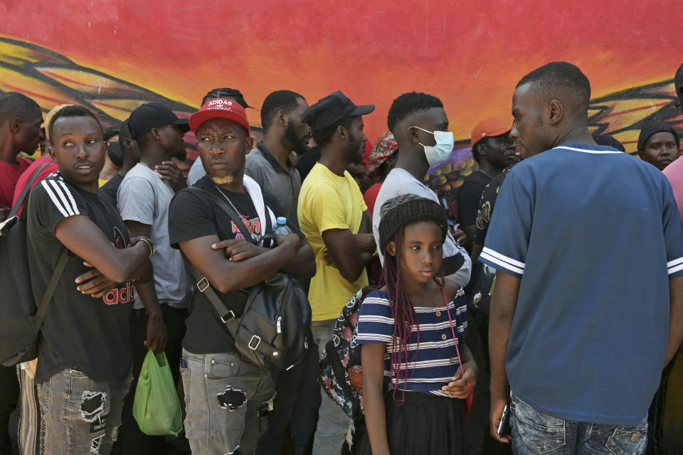 Haitian migrants line up at a migrant shelter in Tijuana, Mexico (Carlos Moreno / Sipa via AP file)