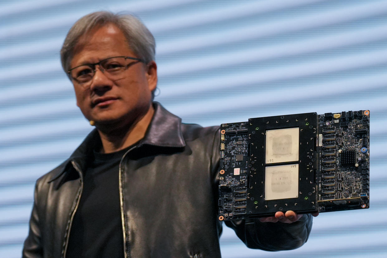 TAIPEI, TAIWAN - 2023/06/01: Jensen Huang, President of NVIDIA holding the Grace hopper superchip CPU used for generative AI at supermicro keynote presentation during the COMPUTEX 2023. The COMPUTEX 2023 runs from 30 May to 02 June 2023 and gathers over 1,000 exhibitors from 26 different countries with 3000 booths to display their latest products and to sign orders with foreign buyers. (Photo by Walid Berrazeg/SOPA Images/LightRocket via Getty Images)