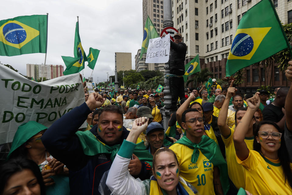 Supporters of President Jair Bolsonaro protest his defeat in the presidential runoff election, in Rio de Janeiro, Brazil, Wednesday, Nov. 2, 2022. Thousands of supporters called on the military Wednesday to keep the far-right leader in power, even as his administration signaled a willingness to hand over the reins to his rival Luiz Inacio Lula da Silva. (AP Photo/Bruna Prado)