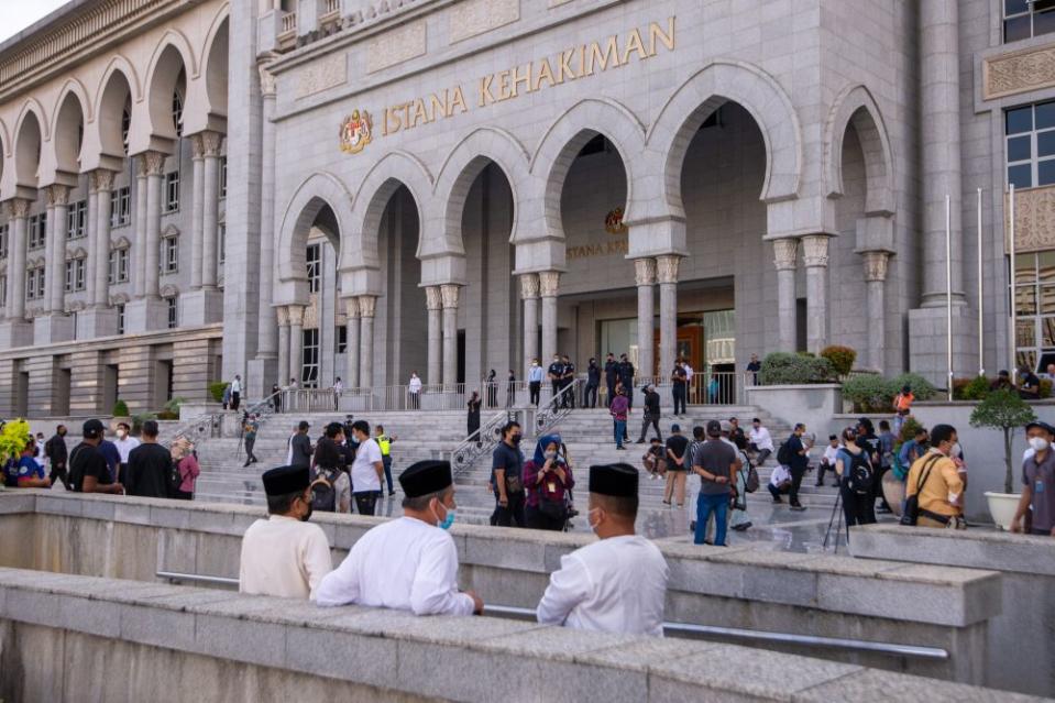 Members of media and supporters of former prime minister Datuk Seri Najib Razak are seen at the Palace of Justice in Putrajaya December 8, 2021. ― Picture by Shafwan Zaidon