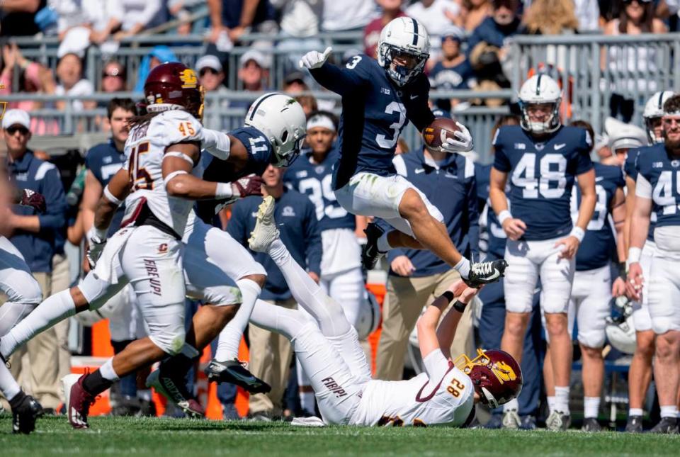 Penn State wide receiver Parker Washington leaps over a Central Michigan defender during the game on Saturday, Sept. 24, 2022.