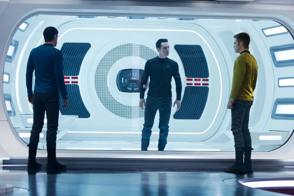 This undated publicity film image released by Paramount Pictures shows, from left, Zachary Quinto, as Spock, Benedict Cumberbatch as John Harrison, and Chris Pine as Kirk, in a scene in the movie, "Star Trek Into Darkness," from Paramount Pictures and Skydance Productions. (AP Photo/Paramount Pictures, Zade Rosenthal)