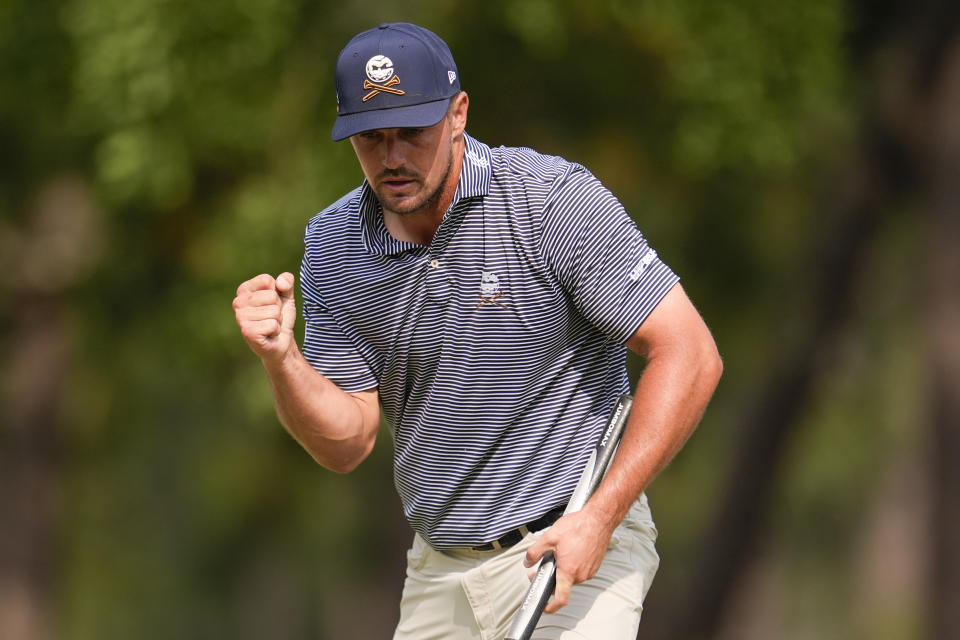 Bryson DeChambeau celebrates after a putt on the 11th hole during the final round of the U.S. Open golf tournament Sunday, June 16, 2024, in Pinehurst, N.C. (AP Photo/George Walker IV)