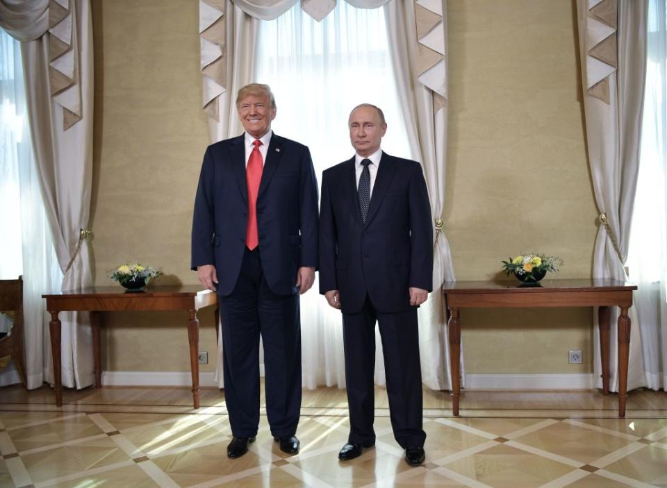 US President Donald Trump (left) and Russia's President Vladimir Putin pose ahead a meeting in Helsinki, on July 16, 2018. 