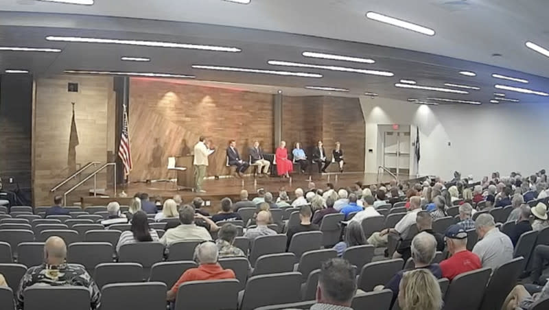 Utah Republican Party Chairman Rob Axson asks candidates for the 2nd Congressional District questions at a debate in St. George on Jan. 22, 2023.