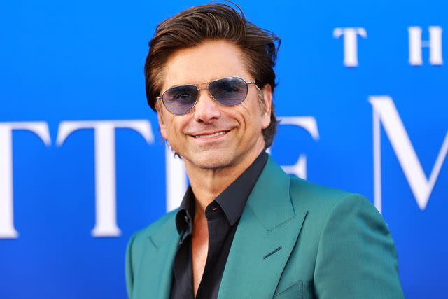 <p>Matt Winkelmeyer/GA/The Hollywood Reporter via Getty</p> John Stamos is pictured attending the world premiere of Disney's 'The Little Mermaid' on May 8, 2023.
