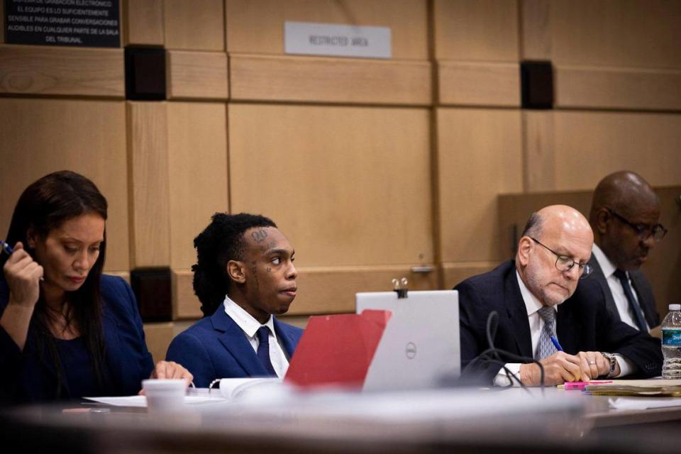 Jamell Demons, better known as YNW Melly, second from the left, sits with his defense attorneys from left to right, Raven Liberty, Stuart Adelstein and David Howard during his trial on Tuesday, June 20, 2023, at the Broward County Courthouse in Fort Lauderdale, Fla.
