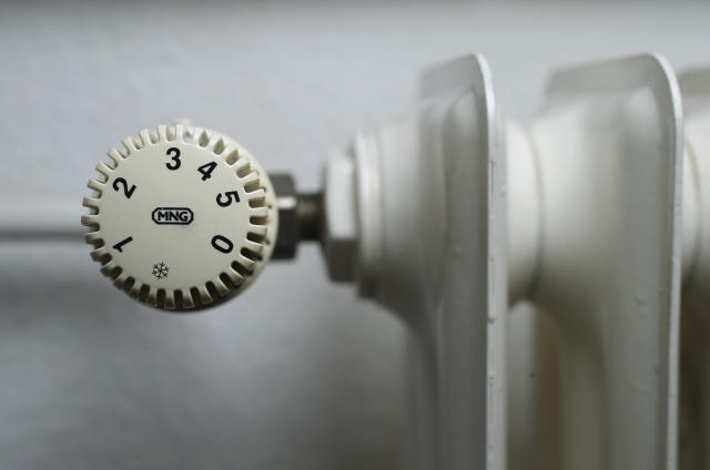 bills BERLIN, GERMANY - FEBRUARY 18:  An older-model thermostat is seen attached to a heating radiator in an apartment on February 18, 2016 in Berlin, Germany. Consumers are expected to enjoy lower-than-average heating bills for this winter season due to the very late start of winter weather and the overall relatively mild temperatures since then.  (Photo by Sean Gallup/Getty Images)
