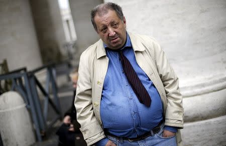 Giuseppe, a homeless man who lives around the Vatican, waits to enter the Vatican March 26, 2015. REUTERS/Max Rossi