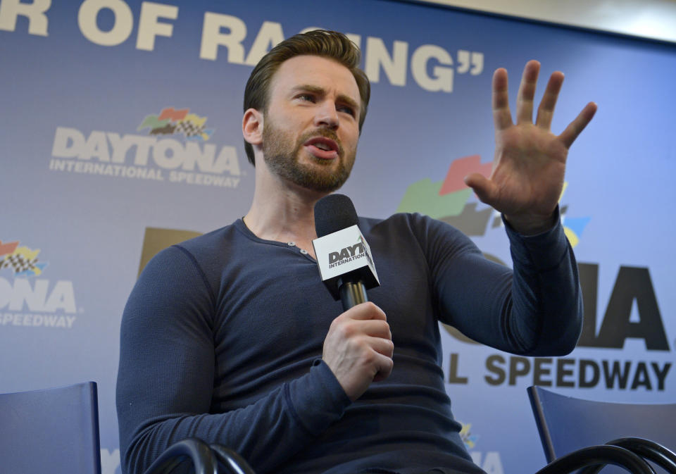 Actor Chris Evans answers a question during a news conference before the NASCAR Daytona 500 Sprint Cup series auto race at Daytona International Speedway in Daytona Beach, Fla., Sunday, Feb. 23, 2014. (AP Photo/Phelan M. Ebenhack)