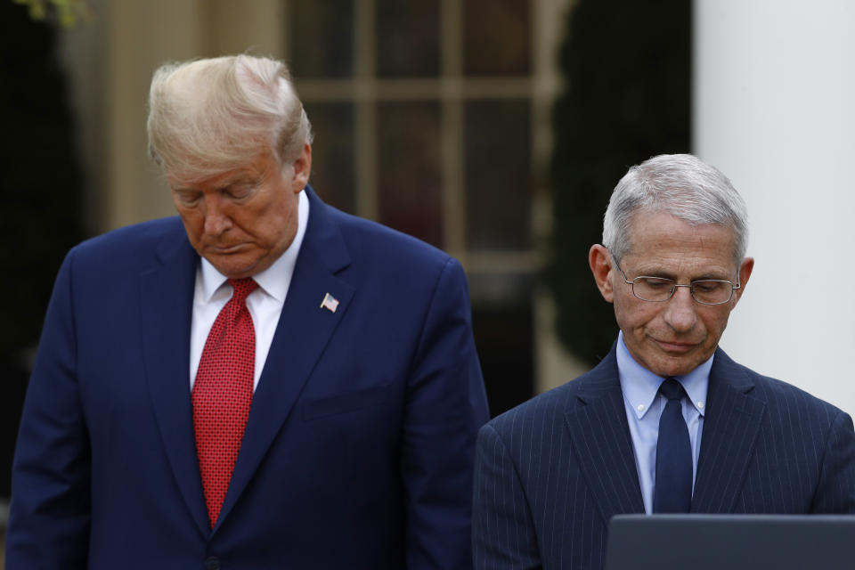 Dr. Anthony Fauci, right, director of the National Institute of Allergy and Infectious Diseases, attends a coronavirus task force briefing with President Donald Trump in the Rose Garden of the White House, Sunday, March 29, 2020, in Washington. (AP Photo/Patrick Semansky)