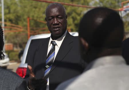 FILE PHOTO - South Sudan's Defence Minister Kuol Manyang Juuk, talks to cabinet members after a cabinet meeting in Juba January 17, 2014. REUTERS/Andreea Campeanu