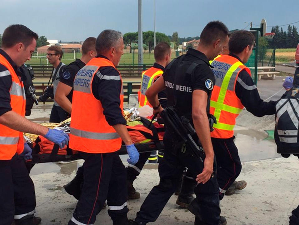 French firemen evacuate an injured passenger