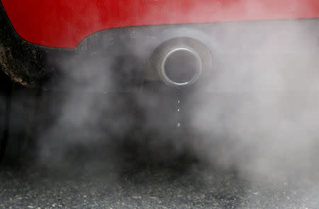 FILE PHOTO: An exhaust emits fumes as a car is driven through Richmond in London, Britain December 2, 2016. REUTERS/Peter Nicholls/File Photo