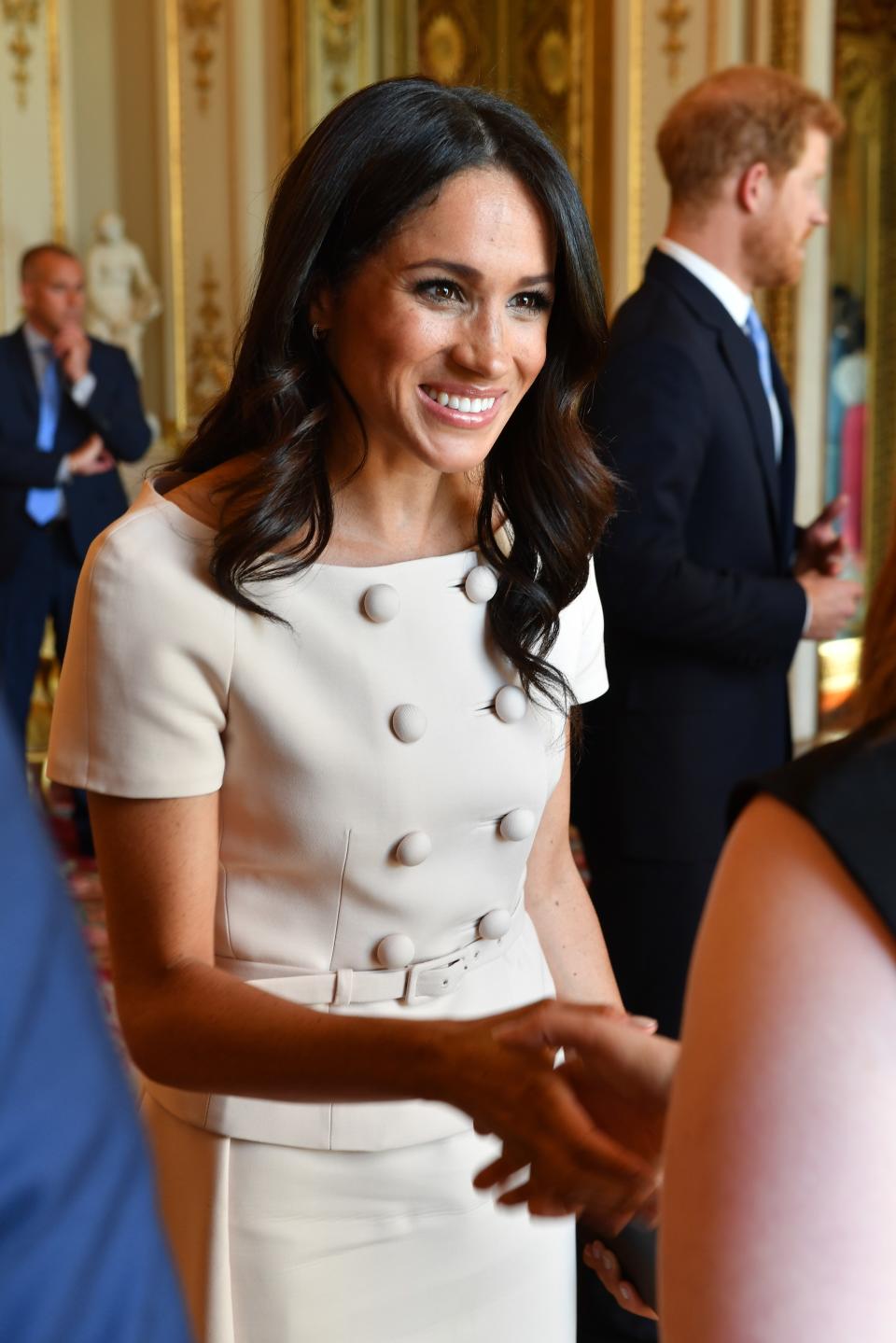 LONDON, ENGLAND - JUNE 26: Meghan, Duchess of Sussex meets guests at the Queen's Young Leaders Awards Ceremony at Buckingham Palace on June 26, 2018 in London, England. The Queen's Young Leaders Programme, now in its fourth and final year, celebrates the achievements of young people from across the Commonwealth working to improve the lives of people across a diverse range of issues including supporting people living with mental health problems, access to education, promoting gender equality, food scarcity and climate change.  (Photo by John Stillwell - WPA Pool/Getty Images)