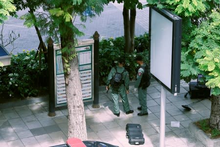 Police Explosive Ordnance Disposal (EOD) officers work following a small explosion at a site in Bangkok