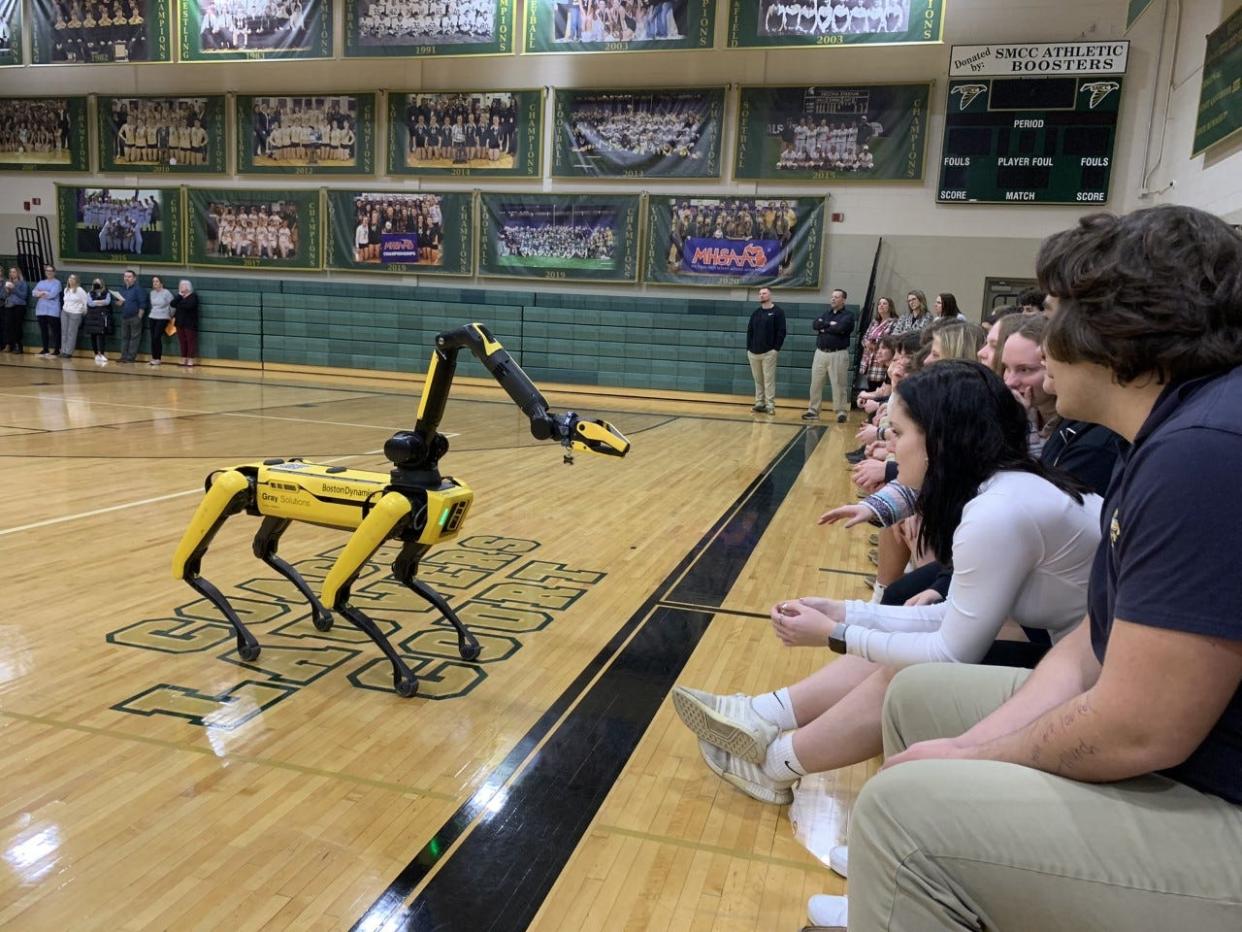 St. Mary Catholic Central High School students watch Spot in action. Spot is a Boston Dynamics robotic dog that Gray Solutions uses to introduce students to STEM and engineering careers.