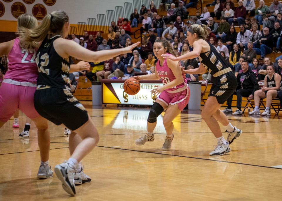 Gibson Southern’s Nola Ravellette (20) drives as the Gibson Southern Lady Titans play the Washington Lady Hatchets Saturday, Jan. 13, 2024.