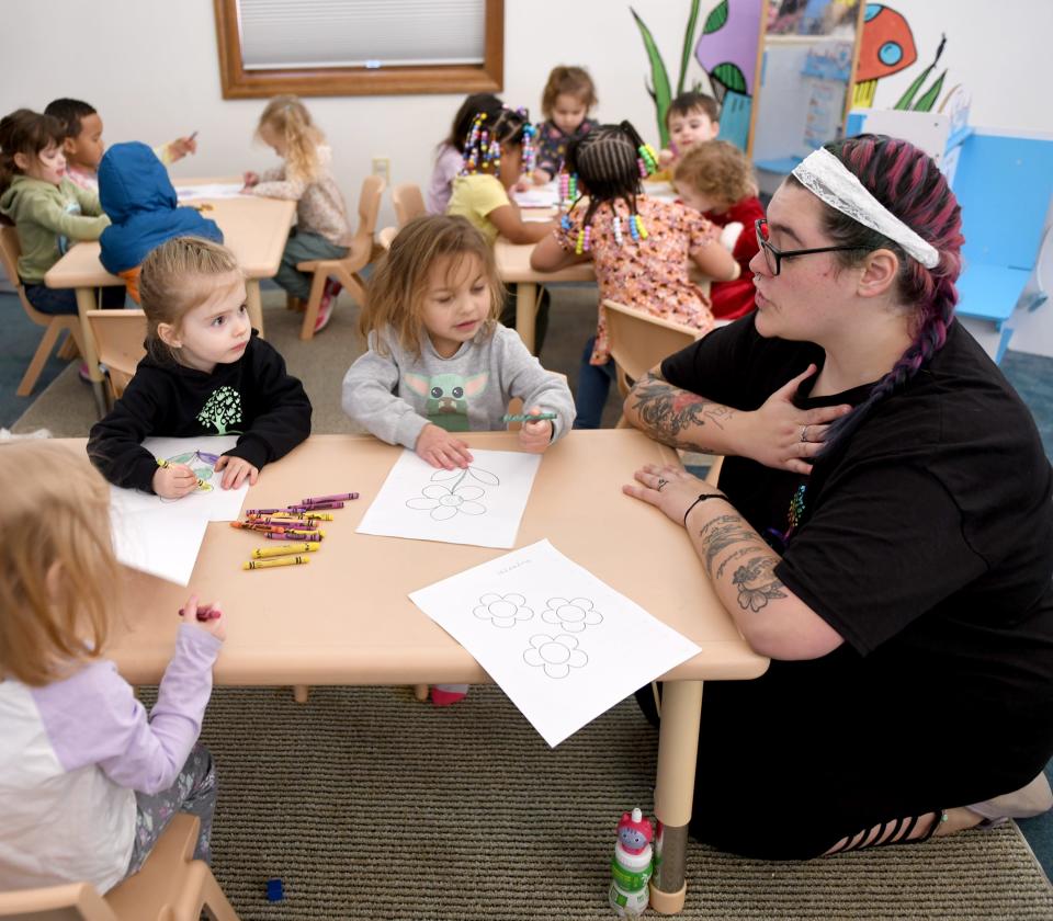 Lead Teacher Brianna Youmans (right) leads a class Tuesday at Little Sprouts Daycare & Preschool in downtown Massillon. The business is expanding to a second facility in the summer.