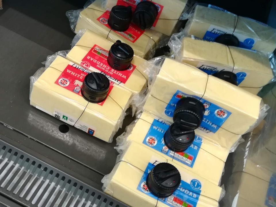 Blocks of cheese at Aldi with security tags on