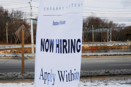 FILE PHOTO: A sign advertises open jobs at an Embassy Suites hotel in Waltham, Massachusetts, U.S., December 13, 2017. REUTERS/Brian Snyder/File Photo