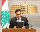 FILE PHOTO: Lebanon's Prime Minister Hassan Diab speaks during a televised address to the the nation at the governmental palace in Beirut