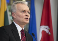 Economist Gitanas Nauseda speaks at a press conference in Vilnius, Lithuania, Monday, May 27, 2019, following his landslide victory in Lithuania's presidential election. Nauseda won the presidential election after his opponent conceded defeat Sunday. (AP Photo/Mindaugas Kulbis)