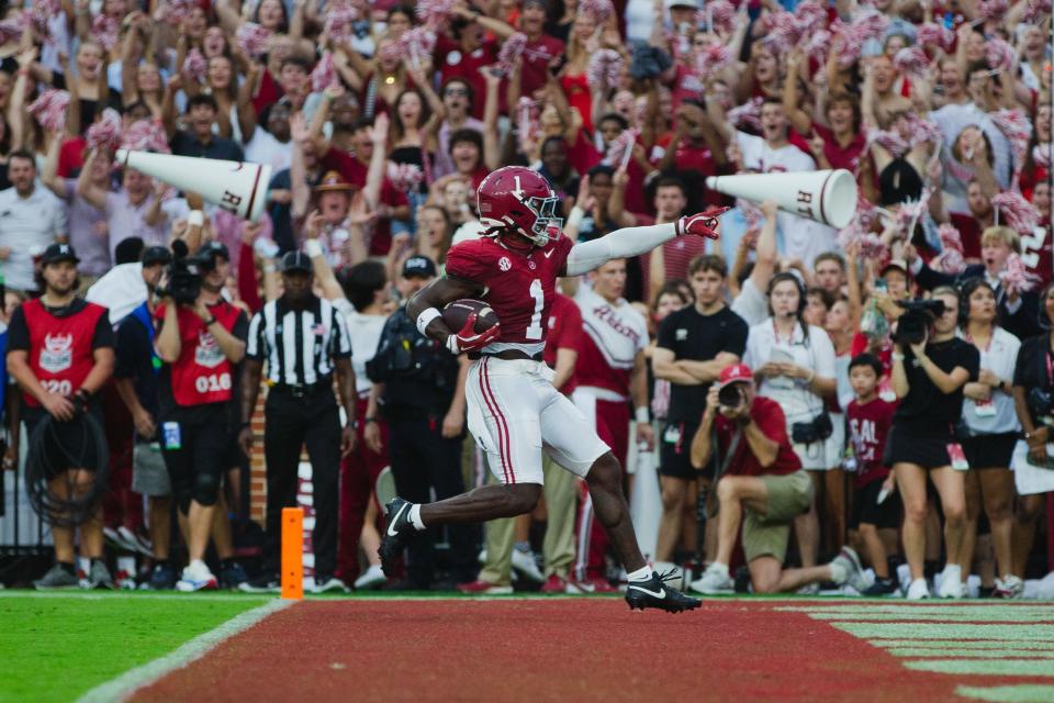 Aug 31, 2024; Tuscaloosa, Alabama, USA; Alabama Crimson Tide wide receiver Kendrick Law (1) scores a touchdown against the Western Kentucky Hilltoppers during the first quarter at Bryant-Denny Stadium. Mandatory Credit: Will McLelland-USA TODAY Sports