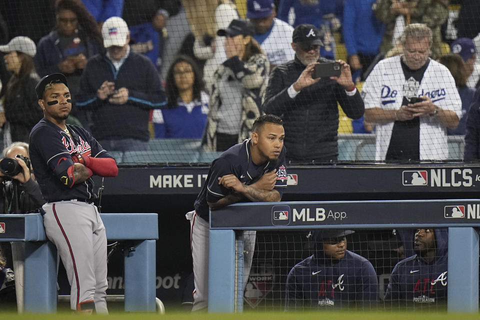 Atlanta Braves watch the ninth inning against the Los Angeles Dodgers from the dugout in Game 5 of baseball's National League Championship Series Thursday, Oct. 21, 2021, in Los Angeles. (AP Photo/Jae C. Hong)