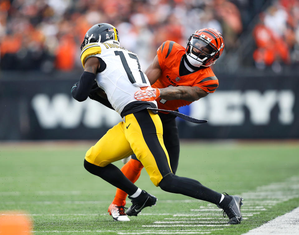Nov 26, 2023; Cincinnati, Ohio, USA; Pittsburgh Steelers safety Trenton Thompson (17) catches the interception as <a class="link " href="https://sports.yahoo.com/nfl/teams/cincinnati/" data-i13n="sec:content-canvas;subsec:anchor_text;elm:context_link" data-ylk="slk:Cincinnati Bengals;sec:content-canvas;subsec:anchor_text;elm:context_link;itc:0">Cincinnati Bengals</a> wide receiver Ja’Marr Chase (1) tackles during the third quarter at Paycor Stadium. Mandatory Credit: Joseph Maiorana-USA TODAY Sports