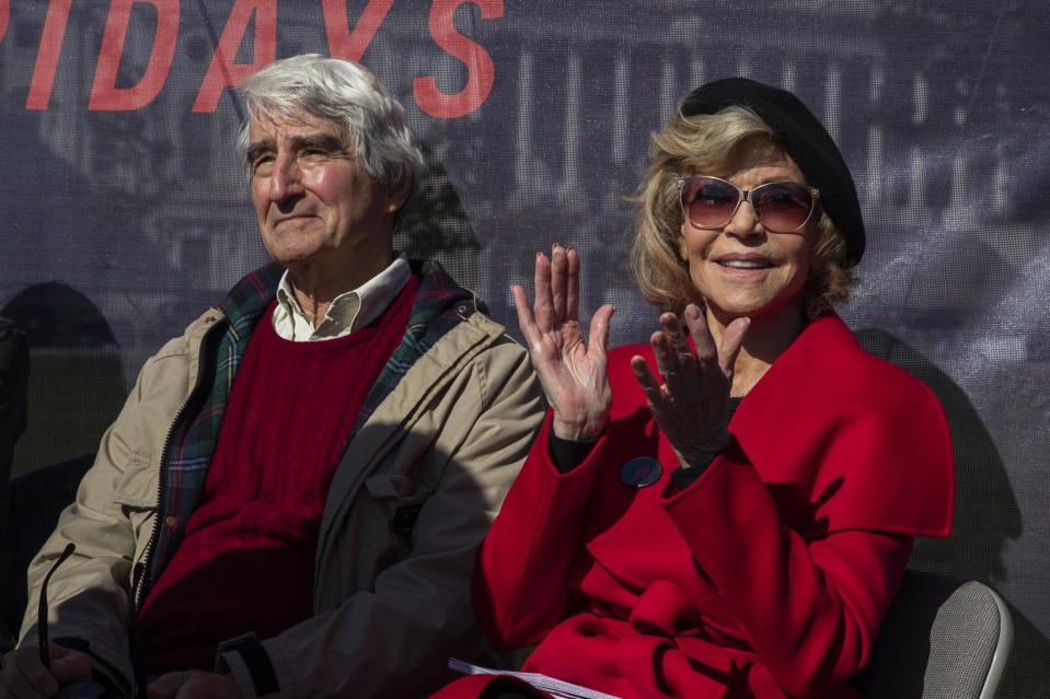 Actors Sam Waterston, left, and Jane Fonda attend a rally on Capitol Hill in Washington, Friday, Oct. 18, 2019. A half-century after throwing her attention-getting celebrity status into Vietnam War protests, Fonda is now doing the same in a U.S. climate movement where the average age is 18. (AP Photo/Manuel Balce Ceneta)