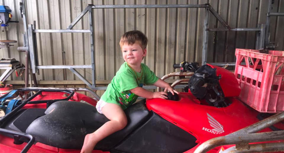 Missing toddler Ruben Scott sits on top of a quad bike.