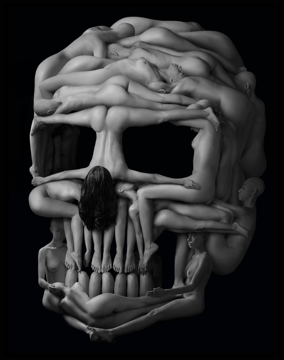 Skull shape made up of human bodies