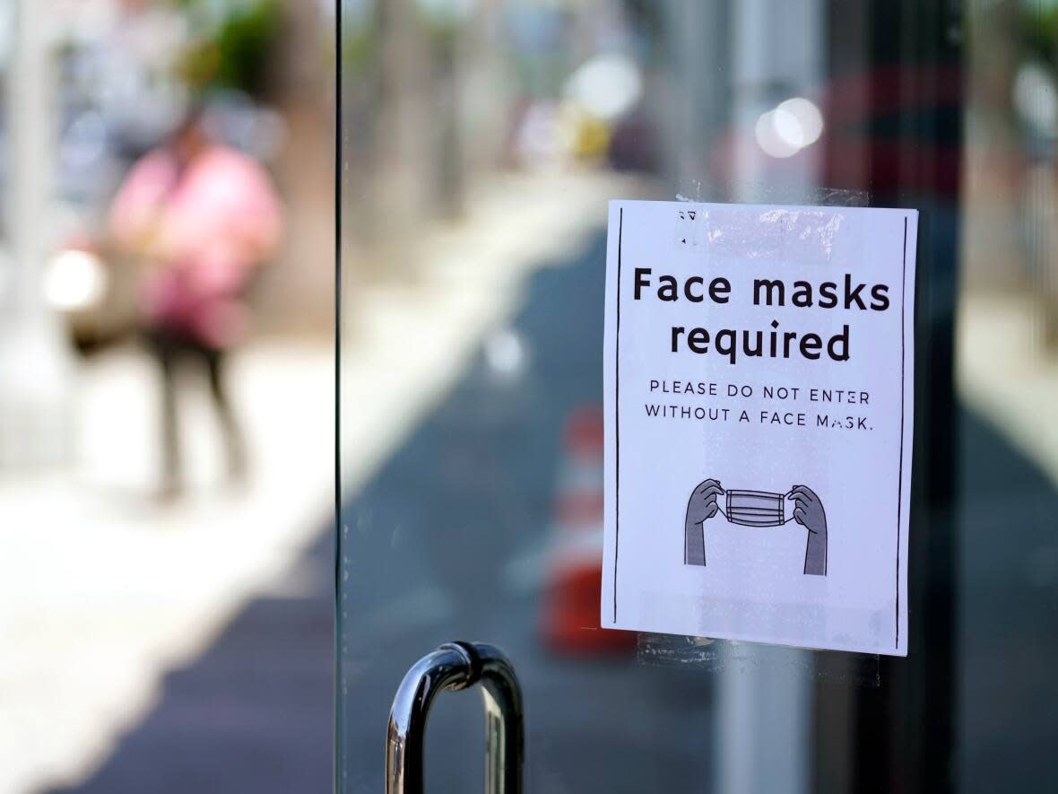 Saskatchewan’s chief medical health officer has signed an extension to a public health order that makes wearing masks in all indoor public spaces and isolating when positive with COVID-19 mandatory in the province until Nov. 30. (Marcio Jose Sanchez/The Associated Press - image credit)