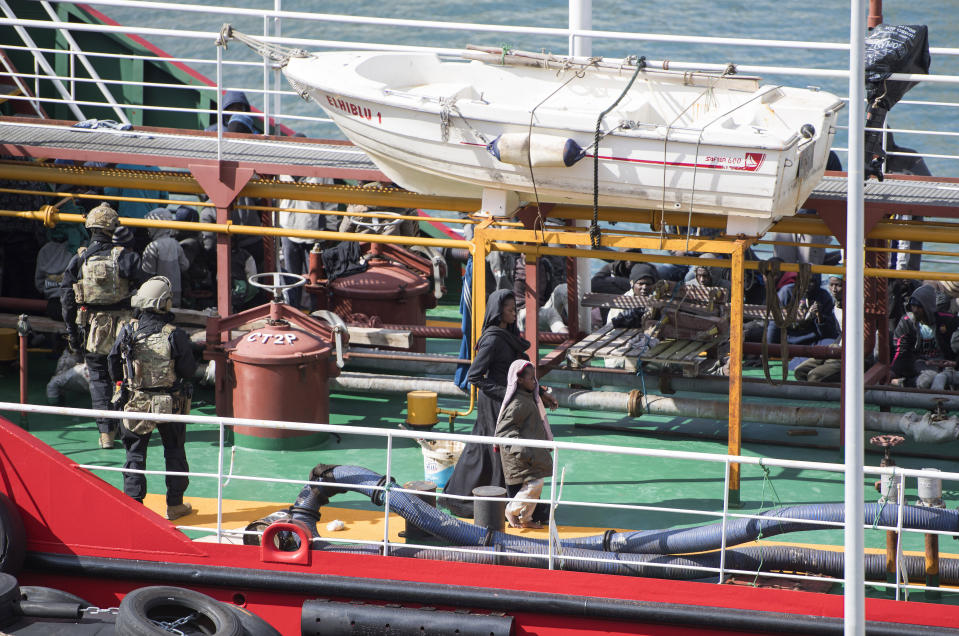 Armed forces stand onboard the Turkish oil tanker El Hiblu 1, which was hijacked by migrants, in Valletta, Malta, Thursday March 28, 2019. A Maltese special operations team on Thursday boarded a tanker that had been hijacked by migrants rescued at sea, and returned control to the captain, before escorting it to a Maltese port. (AP Photo/Rene' Rossignaud)