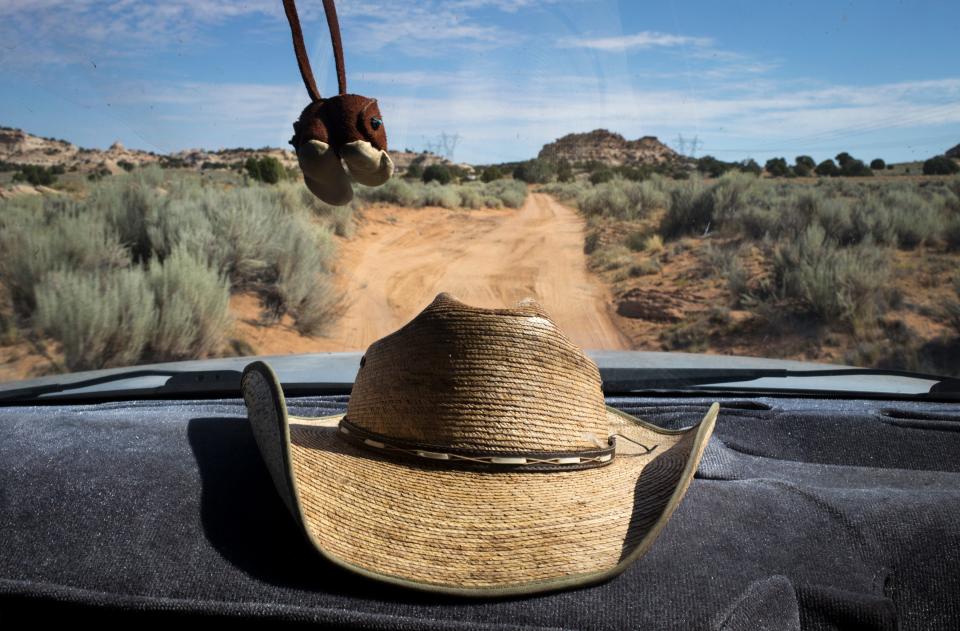 Michael Bigman drives back to his sheep corral on Sept. 6, 2019, in Coppermine, Arizona.