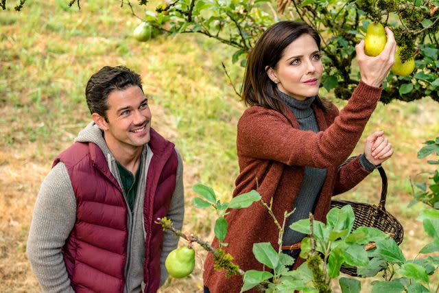 <p>Kailey Schwerman / Hallmark Television / Courtesy: Everett</p> From left: Ryan Paevey and Jen Lilley in "Harvest Love".