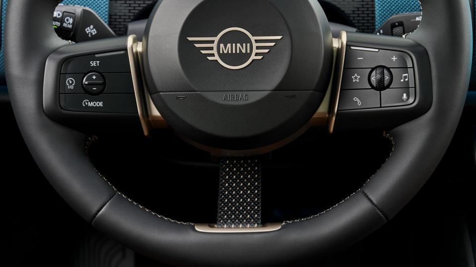 2025 mini cooper countryman electric in light blue with a cream and black interior