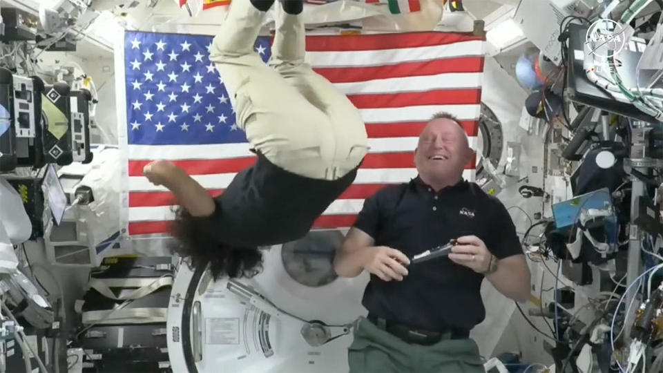 Showing she was enjoying the weightlessness, Williams closed a 20-minute news conference by performing multiple zero-gravity flips in the International Space Station's Japanese Kibo laboratory module as colleague Butch Wilmore looked on.  / Credit: NASA TV