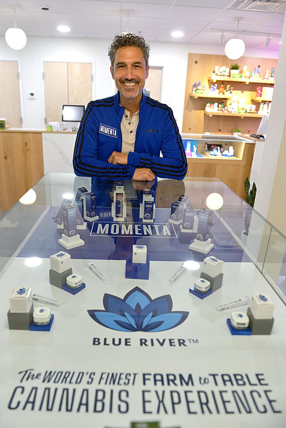 "Survivor" star Ethan Zohn pictured with products from Trulieve's Momenta brand, for which Zohn serves as an ambassador. He will run the 2022 Boston Marathon while using Momenta cannabis products.