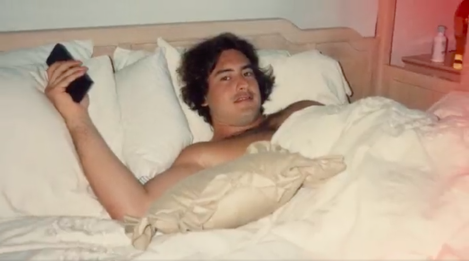 Pedro "Peggy" Rosello reclines on his bed in his fifth-floor condo at Champlain Towers South in Surfside, Florida. Rosello, who was featured in Netflix's new docuseries "Cocaine Cowboys: The Kings of Miami," smuggled drugs while living in the building from 1988-1991.