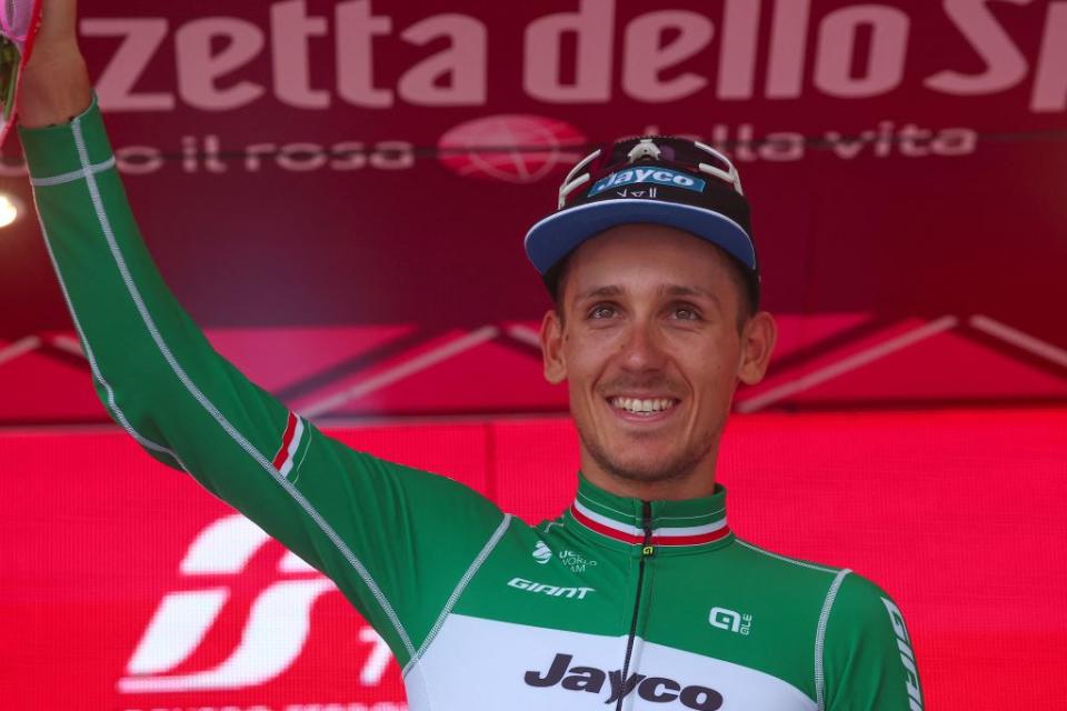 Team Jayco AlUlas Filippo Zana rider celebrates on the podium after winning the eighteenth stage of the Giro dItalia 2023 cycling race 161 km between Oderzo and Val di Zoldo on May 25 2023  Photo by Luca Bettini  AFP Photo by LUCA BETTINIAFP via Getty Images