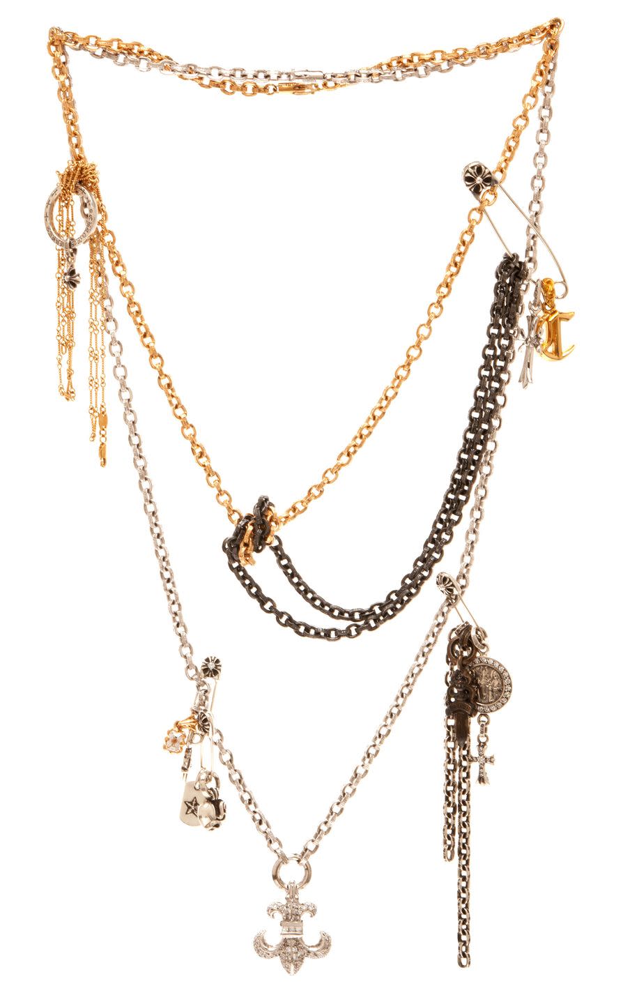 necklaces with various charms and gold safety pin like charms