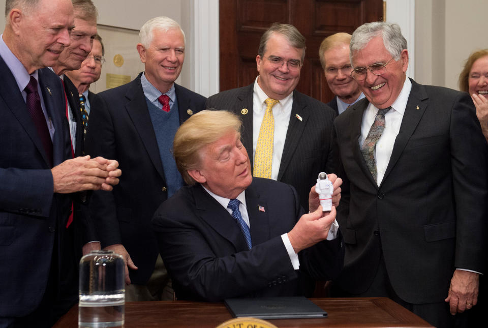 President Trump during the signing of his first space directive, with moonwalker and former Senator Harrison Schmitt, at right