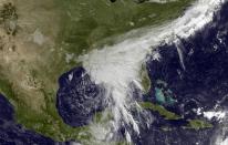 <p>This satellite image taken June 20, 2017, and released by the National Oceanic and Atmospheric Administration shows a tropical storm over the Gulf of Mexico approaching the Gulf Coast. Tropical Storm Cindy hovered over the Gulf of Mexico south of Louisiana on Tuesday, churning tides and spinning bands of rain over the central and eastern Gulf Coast. (Photo: NOAA via AP) </p>