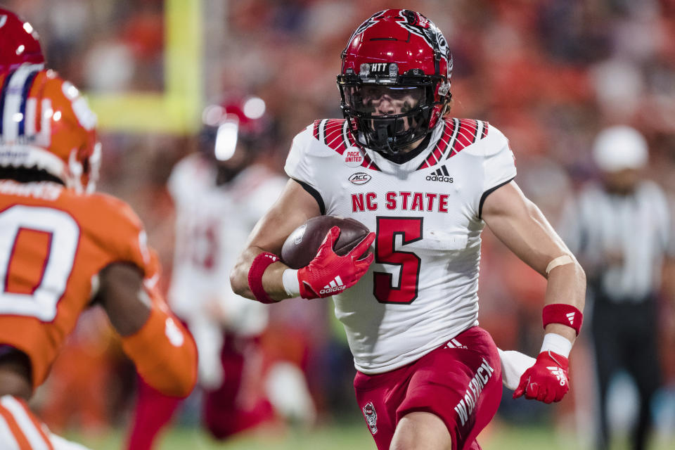 North Carolina State wide receiver Thayer Thomas (5) runs with the ball in the first half of an NCAA college football game against Clemson, Saturday, Oct. 1, 2022, in Clemson, S.C. (AP Photo/Jacob Kupferman)