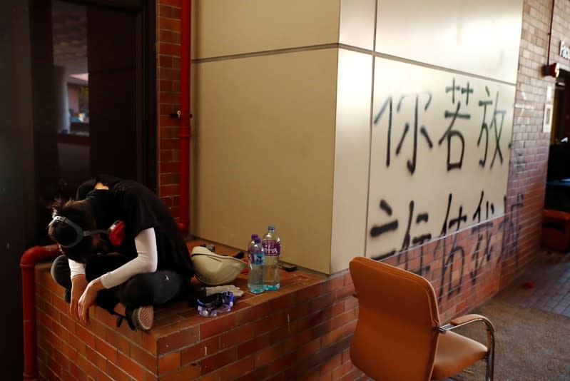 Protesters clash with police outside Hong Kong Polytechnic University (PolyU) in Hong Kong